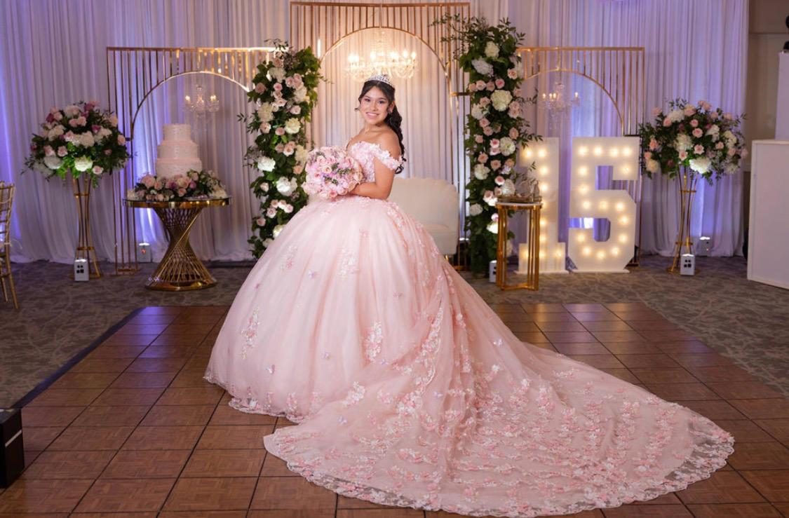 Blush quinceañera portrait with lit 15 marquee